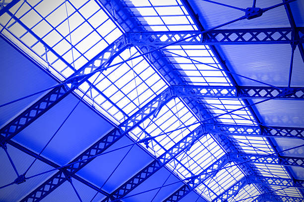 Industrial ceiling of a railway station toned in the blue color