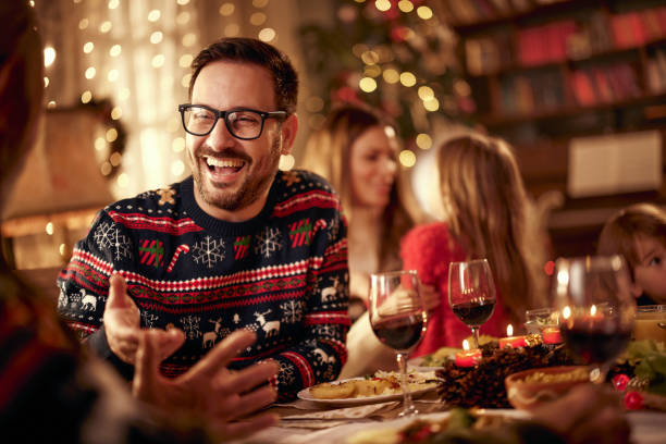 istock Happy man enjoying in conversation on Christmas Eve. 1777673374