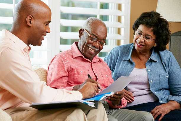 istock Financial Advisor Talking To Senior Couple At Home 177767361