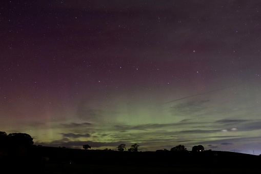 Green, red and pink Northern Lights above Northumberland