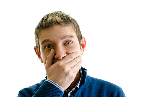 istock Handsome young man covering mouth with hand 177767749