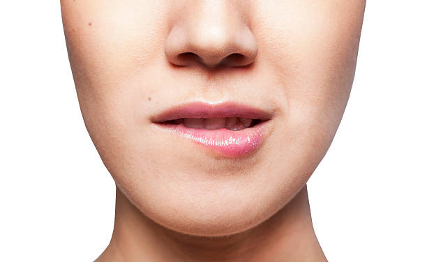 istock Woman bites her lips closeup 177768069