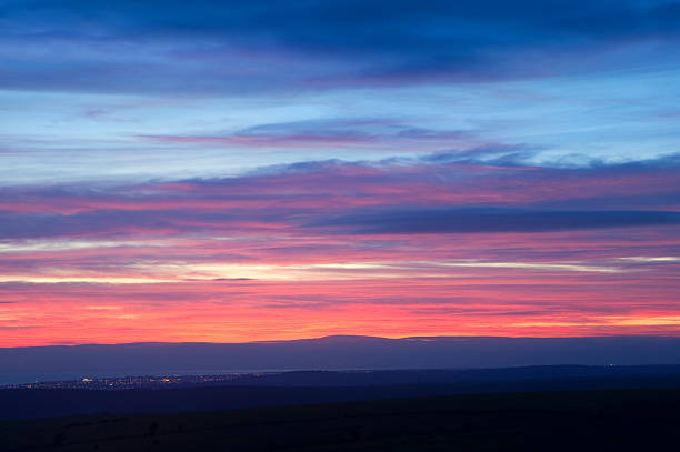 istock Fiery Winter sunset over town at night 177768225