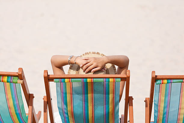 istock Woman on beach chair 177768242