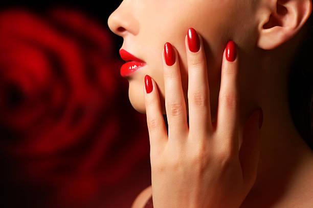 Makeup and manicure Makeup and manicure. Girl with beautiful make-up red nail polish stock pictures, royalty-free photos & images