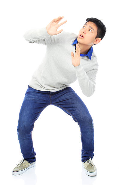 Asian Boy Holding Out His Hands To Avoid Danger