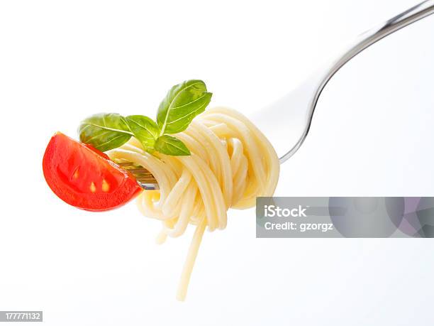 Spaghetti Pasta With Tomato And Basil On Fork Stock Photo - Download Image Now - Basil, Close-up, Crockery