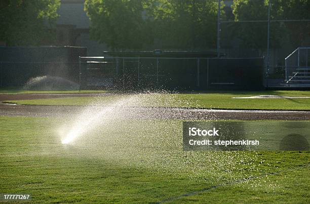 Baseball Field Sprinkler Waters The Grass Pointed Right Stock Photo - Download Image Now