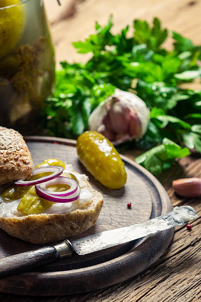 Closeup of sandwich with gherkin, lard and onion