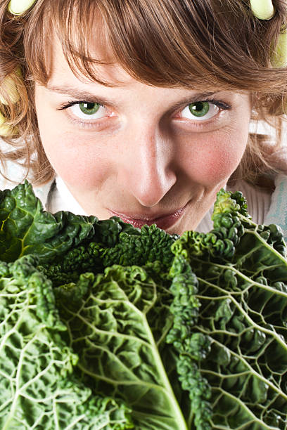 istock woman and fresh savoy cabbage 177772178