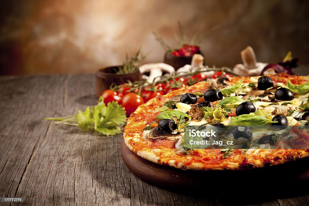 Pizza Delicious italian pizza served on wooden table Baked Stock Photo