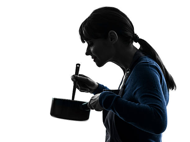 istock woman cooking mixing saucepan silhouette 177773695
