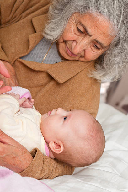 istock Great Grandma Holding Baby 177773851