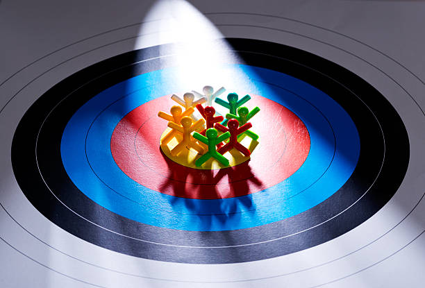 Target the right customers Target the your customers, People on target paperTarget  niche photos stock pictures, royalty-free photos & images