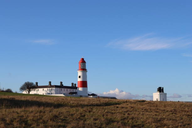 istock Red and white striped lighthouse with foghorn 1777751307