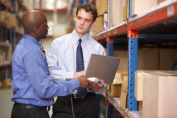 istock Two Businessmen With Laptop In Warehouse 177776094
