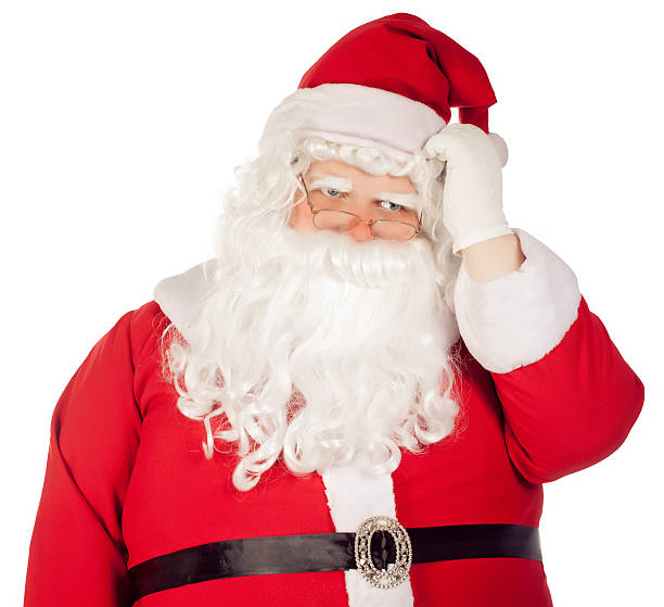 pensive Santa Claus scratching  his head stock photo
