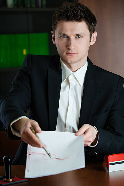 istock Notary public showing where to sign.to 177776438
