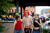 Young gay friends walking in New York City, summertime