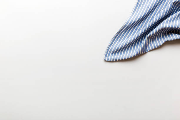 istock top view with blue kitchen napkin isolated on table background. Folded cloth for mockup with copy space, Flat lay. Minimal style 1777771636