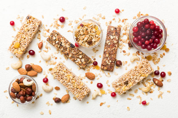 istock Various granola bars on table background. Cereal granola bars. Superfood breakfast bars with oats, nuts and berries, close up. Superfood concept 1777771742