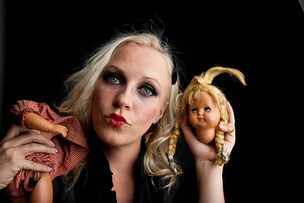 istock Creepy girl and doll portrait 177777344