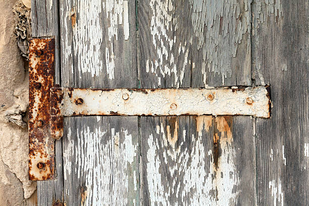 istock Rusting hinge on old wooden door 177777615