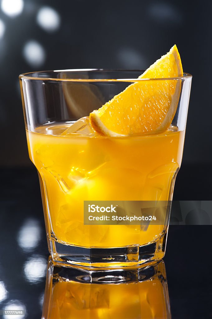 screw driver screw driver cocktail in front of disco lights Alcohol - Drink Stock Photo