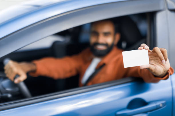 istock Arabic Man Driving Showing Empty Card From Window In Auto 1777779055