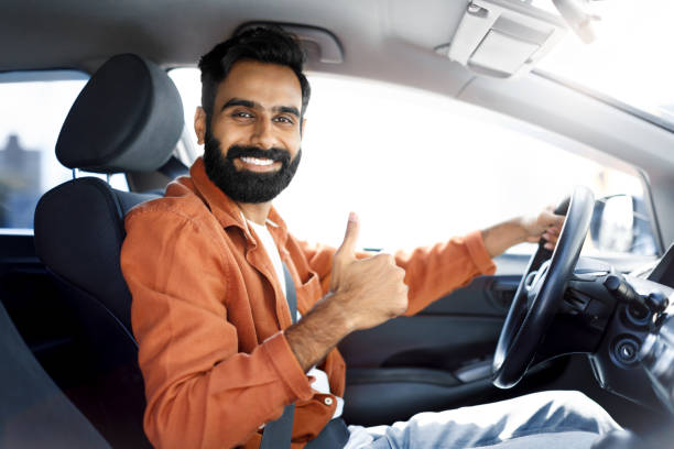 istock Happy Indian Driver Man Gesturing Thumbs Up Driving Car 1777779616