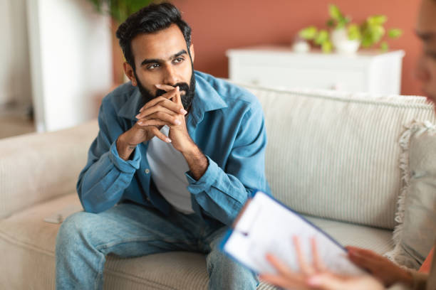 istock Middle Eastern Bearded Man Thinking Consulting With Therapist In Office 1777780265