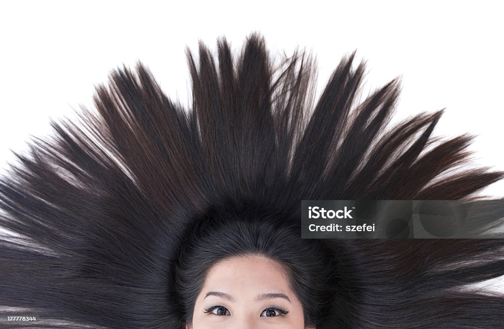 Scatter hair Beautiful young Asian girl lying on white with scatter hair Black Hair Stock Photo