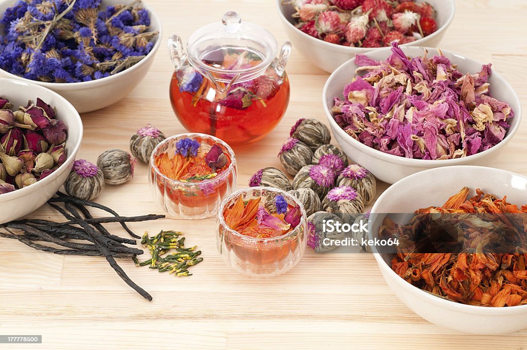 Herbal natural floral tea infusion with dry flowers Herbal natural floral tea infusion with dry flowers ingredients Alternative Therapy Stock Photo