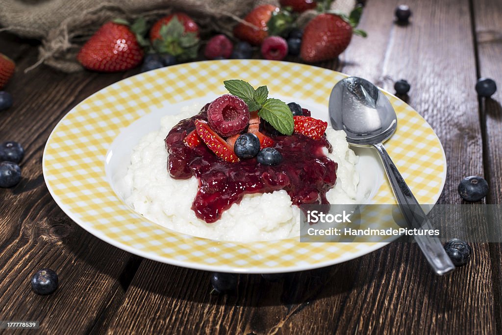 Rice Pudding with fruit sauce Rice Pudding with fruit sauce and mixed fresh fruits Berry Stock Photo