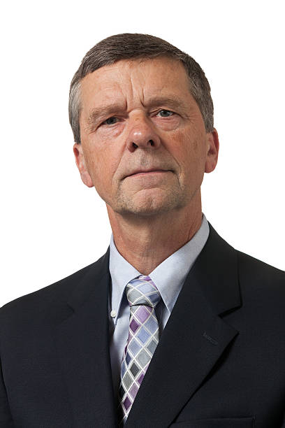 istock Senior man in blue shirt looks pensive 177779211