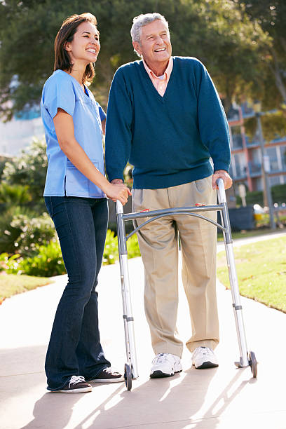 istock Carer Helping Senior Man With Walking Frame 177779277