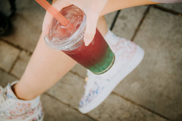 istock two young girl toasting and drinking bubble tea at the cafe 1777794375