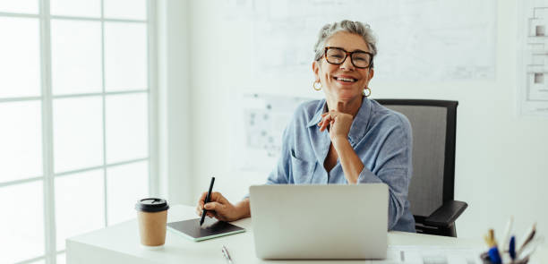 istock Designing with experience, senior graphic designer creates exceptional graphics at her desk 1777794398