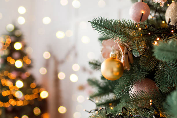 istock Christmas tree branches with decorations, balls, garlands, bokeh. Postcard with space for text. Merry christmas card. Winter holiday theme. Happy New Year. 1777805175