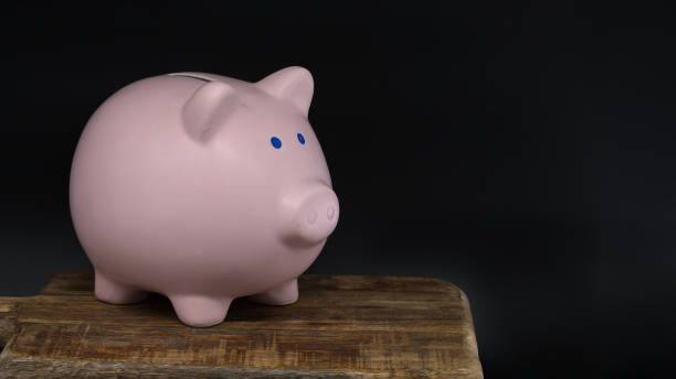 istock Ceramic piggy bank in close up over black background 1777805216