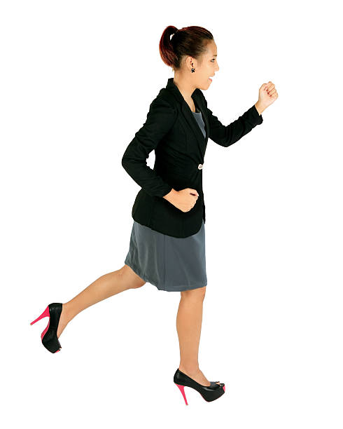 istock Isolated running young business woman on white. 177780680