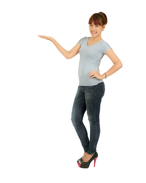 istock Isolated young asian woman presenting over white 177780737