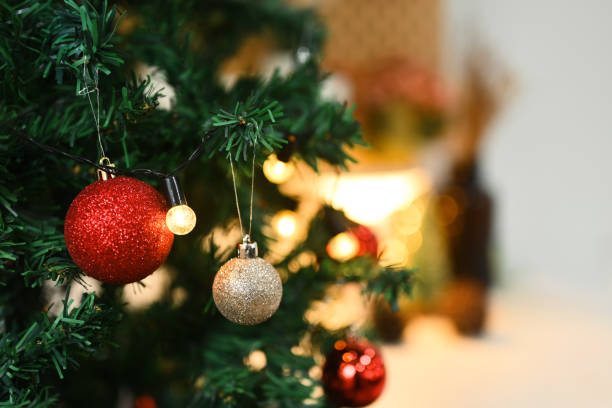 istock Christmas tree decorated with baubles with blurred shiny lights on background 1777810815