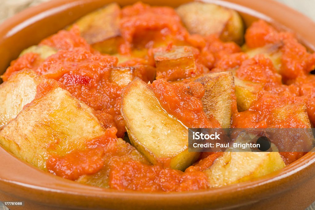 Patatas Bravas Crispy potato chunks in spicy tomato sauce. Traditional Spanish tapas dish. After Work Stock Photo