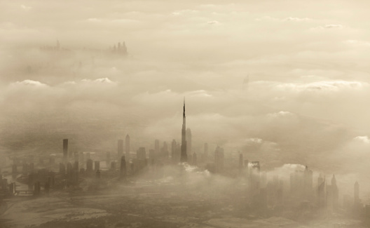 Dramatic sand storm in Dubai, UAE, luxury resort, beautiful city covered with dust, windy weather in desert