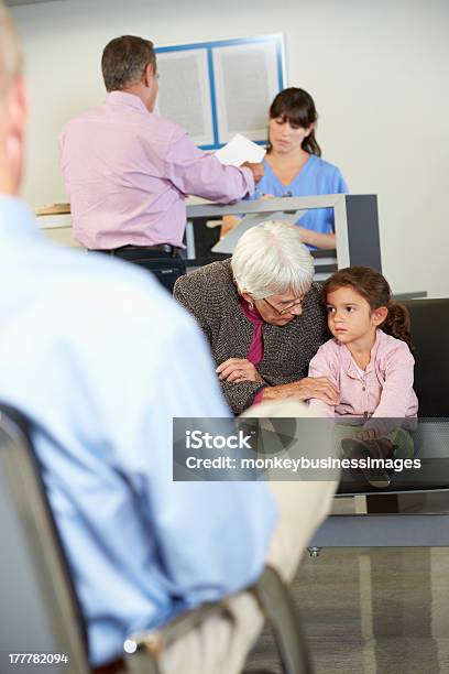 Patients In Doctors Waiting Room Stock Photo - Download Image Now - Doctor's Office, Grandchild, Grandmother