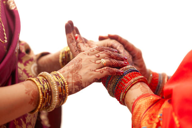 istock Two women with henna tattoos adjust their bangles. 1777822485