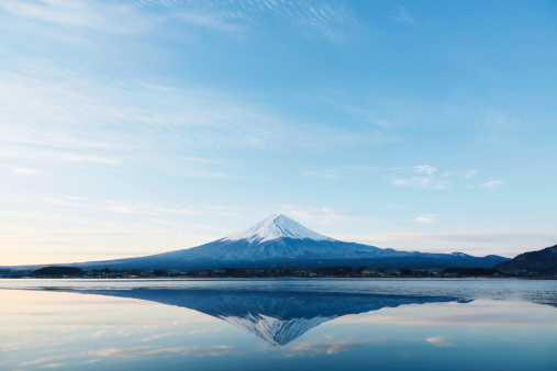 Photo of Mt.Fuji from the lake Kawaguchi in Winter with yellow grass in foreground