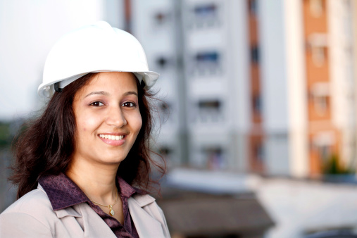 Portrait of smiling Indian female construction architect