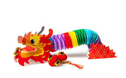 Photo chinese new year concept with hand made dragon, isolated on white background cutout.